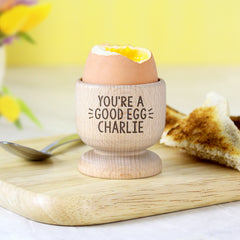Personalised Wooden Egg Cup with Egg Cracked Open and toast in Background