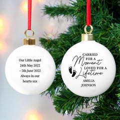 Personalised Carried For A Moment Bauble Hanging From A Christmas Tree