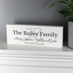 Personalised Family Wooden Block Sign On The Side Next to A Plant