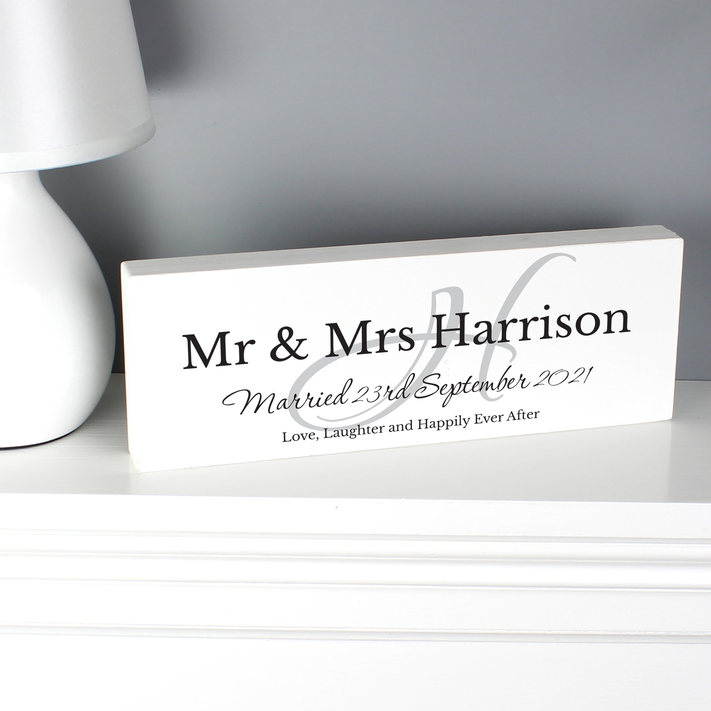 Personalised Family Wooden Block Sign On The Side Next To A Lamp